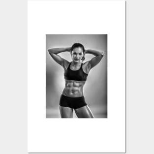 Fitness woman posing in studio Posters and Art
